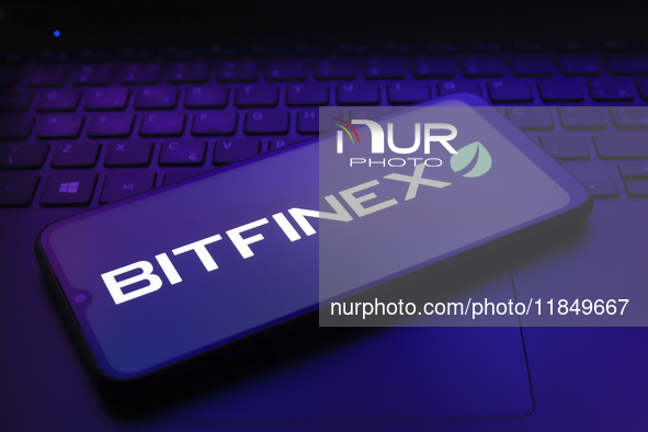 The logo of the cryptocurrency exchange Bitfinex appears on the screen of a smartphone in Reno, United States, on December 9, 2024. 