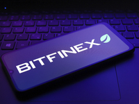 The logo of the cryptocurrency exchange Bitfinex appears on the screen of a smartphone in Reno, United States, on December 9, 2024. (