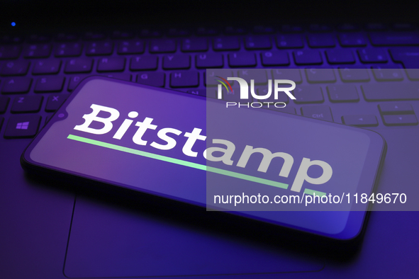 The logo of the cryptocurrency exchange Bitstamp appears on the screen of a smartphone in Reno, United States, on December 9, 2024. 