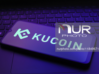 The logo of the cryptocurrency exchange KuCoin appears on the screen of a smartphone in Reno, United States, on December 9, 2024. (