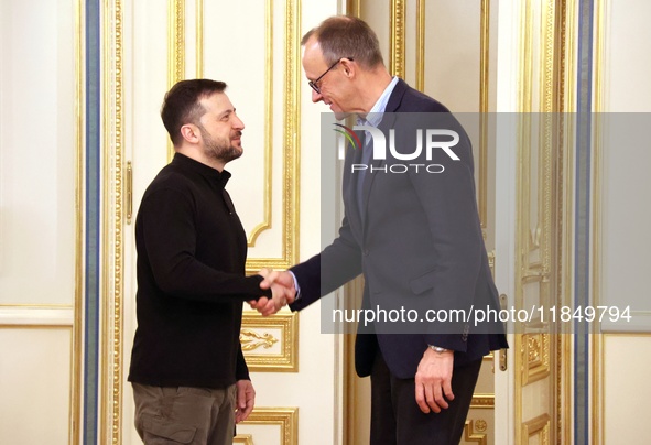 President of Ukraine Volodymyr Zelenskyy shakes hands with German Chancellor candidate, leader of the Christian Democratic Union Friedrich M...