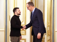 President of Ukraine Volodymyr Zelenskyy shakes hands with German Chancellor candidate, leader of the Christian Democratic Union Friedrich M...