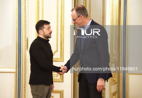 President of Ukraine Volodymyr Zelenskyy shakes hands with German Chancellor candidate, leader of the Christian Democratic Union Friedrich M...