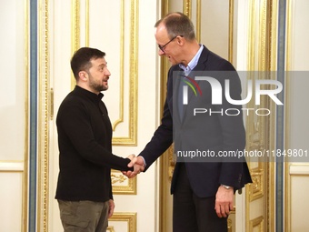 President of Ukraine Volodymyr Zelenskyy shakes hands with German Chancellor candidate, leader of the Christian Democratic Union Friedrich M...