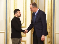 President of Ukraine Volodymyr Zelenskyy shakes hands with German Chancellor candidate, leader of the Christian Democratic Union Friedrich M...