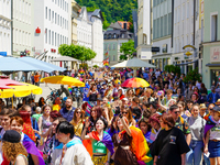 A lively Christopher Street Day, CSD parade winds through the historic streets of Passau's old city in Bavaria, Germany, on June 17, 2023. T...