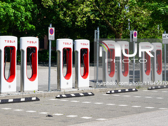 Tesla charging stations for electric cars are in Munich, Bavaria, Germany, on May 15, 2022. With its Superchargers, Tesla owns and operates...