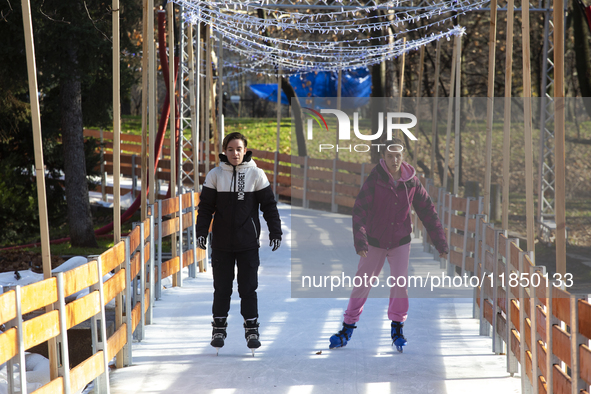 People ice skate in Ice Park Sofia at Knyazheska Garden in Sofia, Bulgaria, on December 9, 2024. 