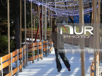 People ice skate in Ice Park Sofia at Knyazheska Garden in Sofia, Bulgaria, on December 9, 2024. (