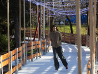 People ice skate in Ice Park Sofia at Knyazheska Garden in Sofia, Bulgaria, on December 9, 2024. (