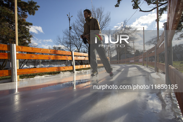 People ice skate in Ice Park Sofia at Knyazheska Garden in Sofia, Bulgaria, on December 9, 2024. 