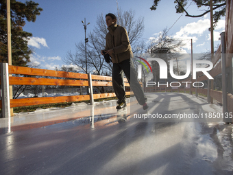 People ice skate in Ice Park Sofia at Knyazheska Garden in Sofia, Bulgaria, on December 9, 2024. (