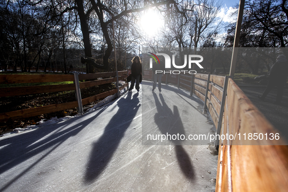 People ice skate in Ice Park Sofia at Knyazheska Garden in Sofia, Bulgaria, on December 9, 2024. 