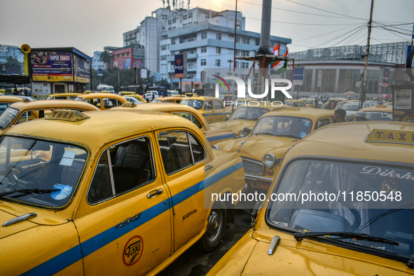 Yellow taxis stand near Sealdah railway station in Kolkata. 