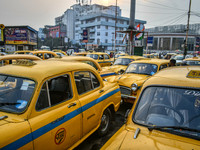 Yellow taxis stand near Sealdah railway station in Kolkata. (