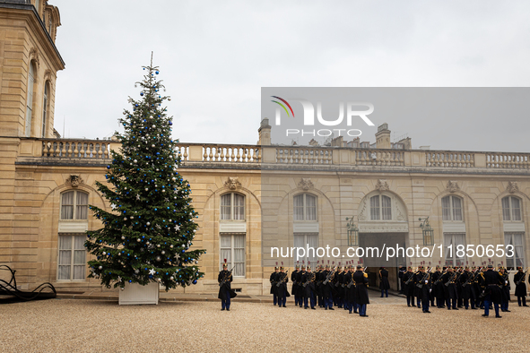 The French Republican Guard stands near the Christmas tree in the courtyard of the Elysee Palace in Paris, France, on September 12, 2024. 