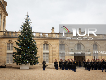 The French Republican Guard stands near the Christmas tree in the courtyard of the Elysee Palace in Paris, France, on September 12, 2024. (