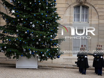 The French Republican Guard stands near the Christmas tree in the courtyard of the Elysee Palace in Paris, France, on September 12, 2024. (