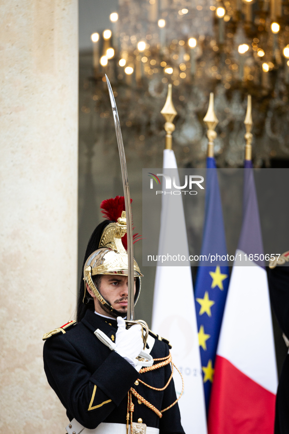 An element of the French Republican Guard stands at the entrance of the Elysee Palace in Paris, France, on September 12, 2024. 