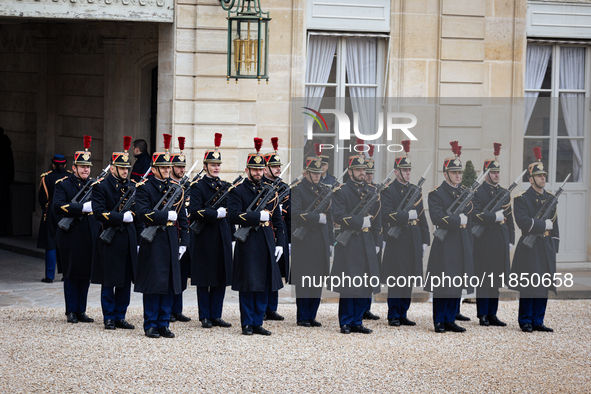 An illustration of the French Republican Guard is in the courtyard of the Elysee Palace in Paris, France, on September 12, 2024. 