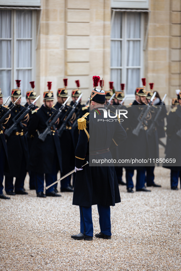 An illustration of the French Republican Guard is in the courtyard of the Elysee Palace in Paris, France, on September 12, 2024. 