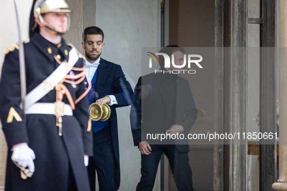 French President Emmanuel Macron stands at the entrance of the Elysee Palace before meeting with the President of Guinea-Bissau, Umaro Sisso...