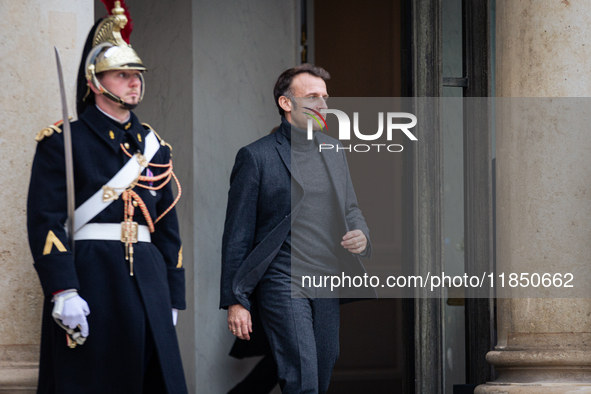 French President Emmanuel Macron stands at the entrance of the Elysee Palace before meeting with the President of Guinea-Bissau, Umaro Sisso...