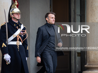 French President Emmanuel Macron stands at the entrance of the Elysee Palace before meeting with the President of Guinea-Bissau, Umaro Sisso...