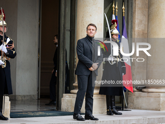 French President Emmanuel Macron stands at the entrance of the Elysee Palace before meeting with the President of Guinea-Bissau, Umaro Sisso...