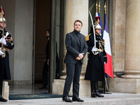 French President Emmanuel Macron stands at the entrance of the Elysee Palace before meeting with the President of Guinea-Bissau, Umaro Sisso...