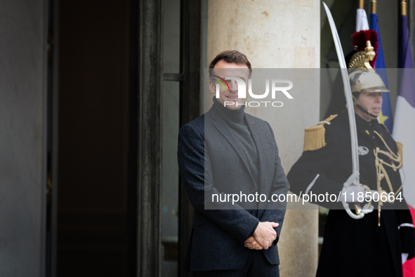 French President Emmanuel Macron stands at the entrance of the Elysee Palace before meeting with the President of Guinea-Bissau, Umaro Sisso...