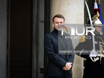 French President Emmanuel Macron stands at the entrance of the Elysee Palace before meeting with the President of Guinea-Bissau, Umaro Sisso...