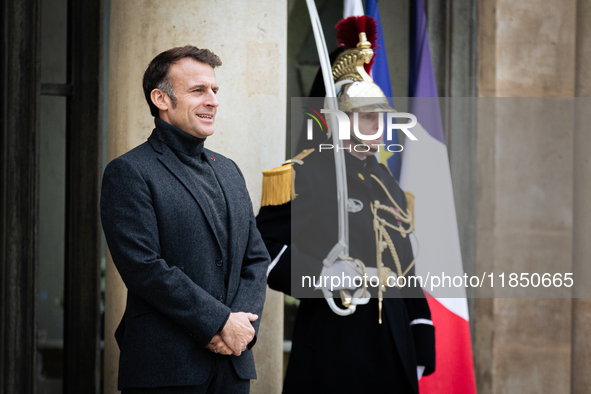 French President Emmanuel Macron stands at the entrance of the Elysee Palace before meeting with the President of Guinea-Bissau, Umaro Sisso...