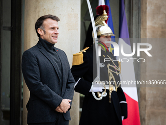 French President Emmanuel Macron stands at the entrance of the Elysee Palace before meeting with the President of Guinea-Bissau, Umaro Sisso...