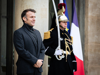 French President Emmanuel Macron stands at the entrance of the Elysee Palace before meeting with the President of Guinea-Bissau, Umaro Sisso...