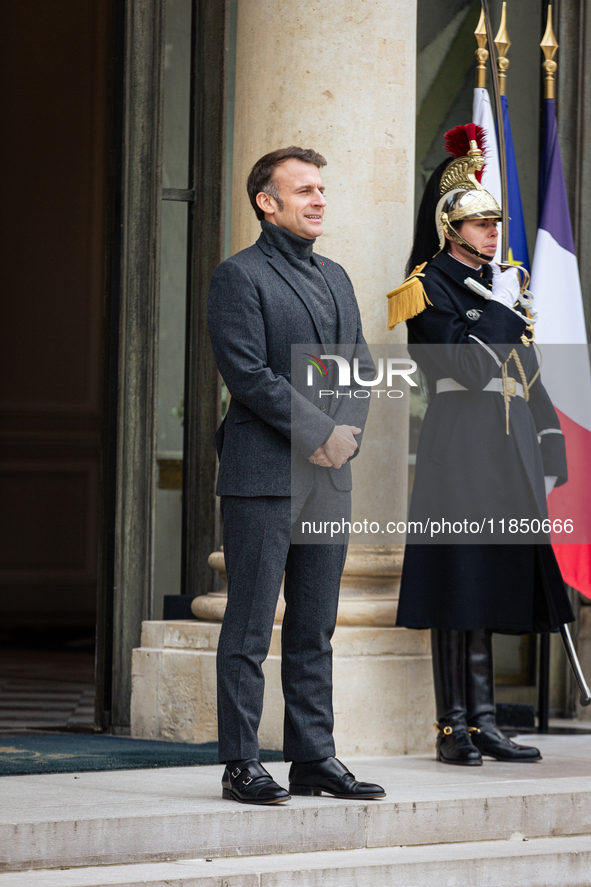 French President Emmanuel Macron stands at the entrance of the Elysee Palace before meeting with the President of Guinea-Bissau, Umaro Sisso...