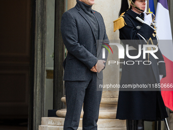 French President Emmanuel Macron stands at the entrance of the Elysee Palace before meeting with the President of Guinea-Bissau, Umaro Sisso...