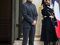 French President Emmanuel Macron stands at the entrance of the Elysee Palace before meeting with the President of Guinea-Bissau, Umaro Sisso...