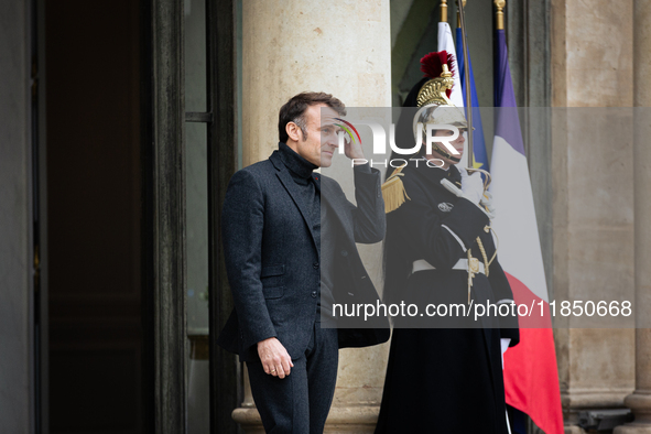 French President Emmanuel Macron stands at the entrance of the Elysee Palace before meeting with the President of Guinea-Bissau, Umaro Sisso...