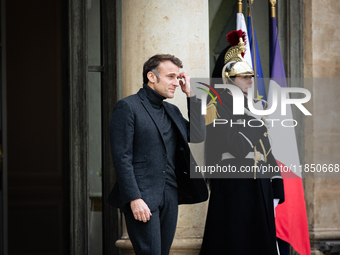 French President Emmanuel Macron stands at the entrance of the Elysee Palace before meeting with the President of Guinea-Bissau, Umaro Sisso...