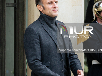 French President Emmanuel Macron stands at the entrance of the Elysee Palace before meeting with the President of Guinea-Bissau, Umaro Sisso...