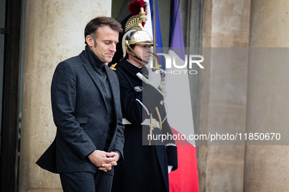 French President Emmanuel Macron stands at the entrance of the Elysee Palace before meeting with the President of Guinea-Bissau, Umaro Sisso...