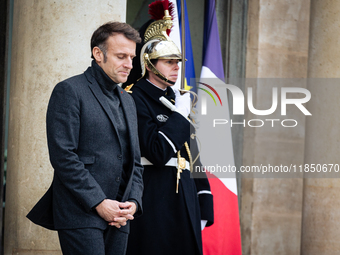 French President Emmanuel Macron stands at the entrance of the Elysee Palace before meeting with the President of Guinea-Bissau, Umaro Sisso...