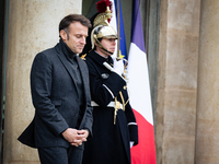 French President Emmanuel Macron stands at the entrance of the Elysee Palace before meeting with the President of Guinea-Bissau, Umaro Sisso...