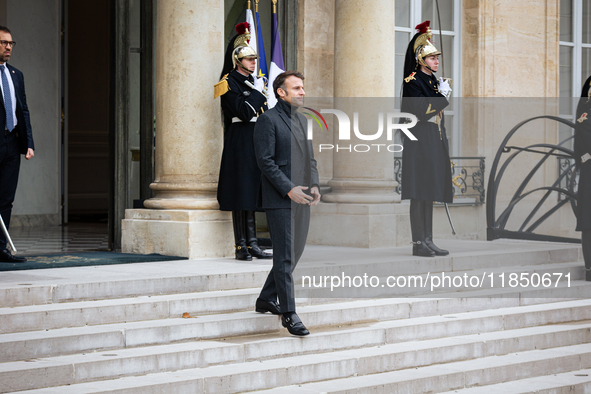 French President Emmanuel Macron stands at the entrance of the Elysee Palace before meeting with the President of Guinea-Bissau, Umaro Sisso...