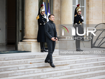 French President Emmanuel Macron stands at the entrance of the Elysee Palace before meeting with the President of Guinea-Bissau, Umaro Sisso...