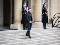 French President Emmanuel Macron stands at the entrance of the Elysee Palace before meeting with the President of Guinea-Bissau, Umaro Sisso...