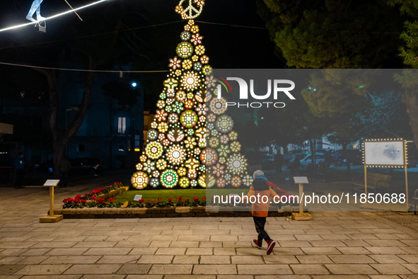 A Christmas tree stands in the Municipal Villa of Ruvo di Puglia on December 8, 2024. The courses and streets of Ruvo di Puglia's historic c...