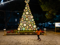 A Christmas tree stands in the Municipal Villa of Ruvo di Puglia on December 8, 2024. The courses and streets of Ruvo di Puglia's historic c...