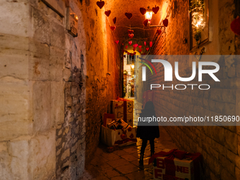 A street in the historic center of Ruvo di Puglia, Italy, on December 8, 2024, displays Christmas decorations. The courses and streets of Ru...